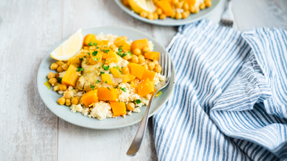 Chicken thighs with squash, couscous and chickpeas.