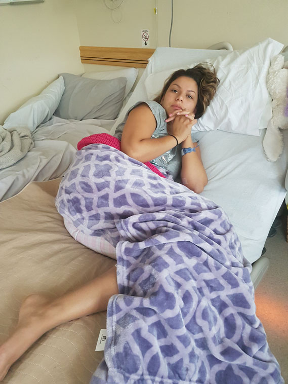 Samantha in her hospital bed